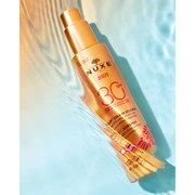 NUXE Sun naptej spray arcra és testre SPF30 (150ml) termék 2. képe